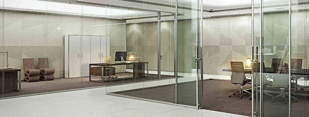 a double-glazed frameless wall separates office spaces