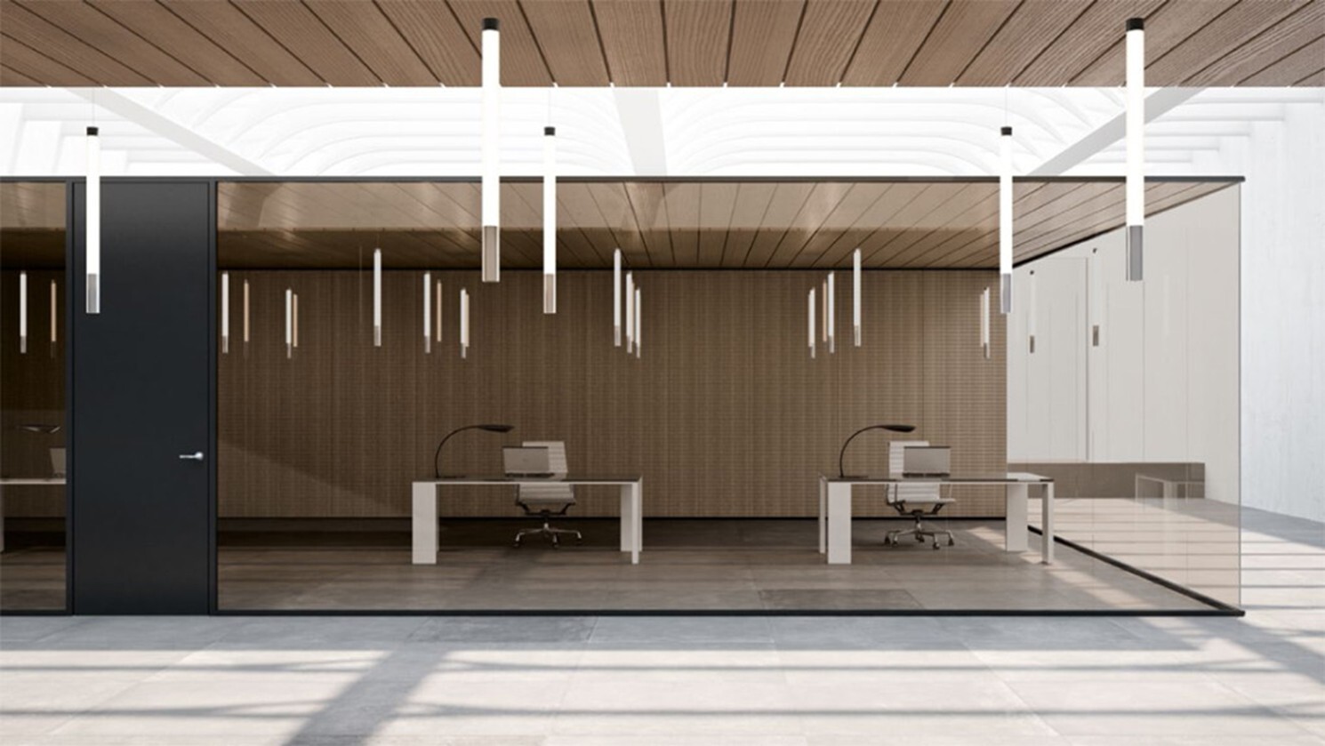 a single-glazed frameless glass wall encompasses a working space