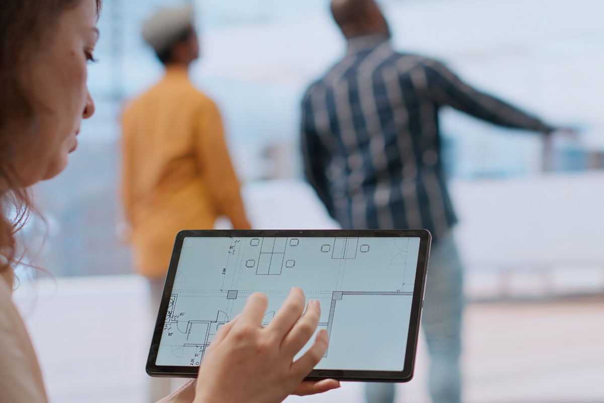 a tablet with an architectural mockup of an office layout