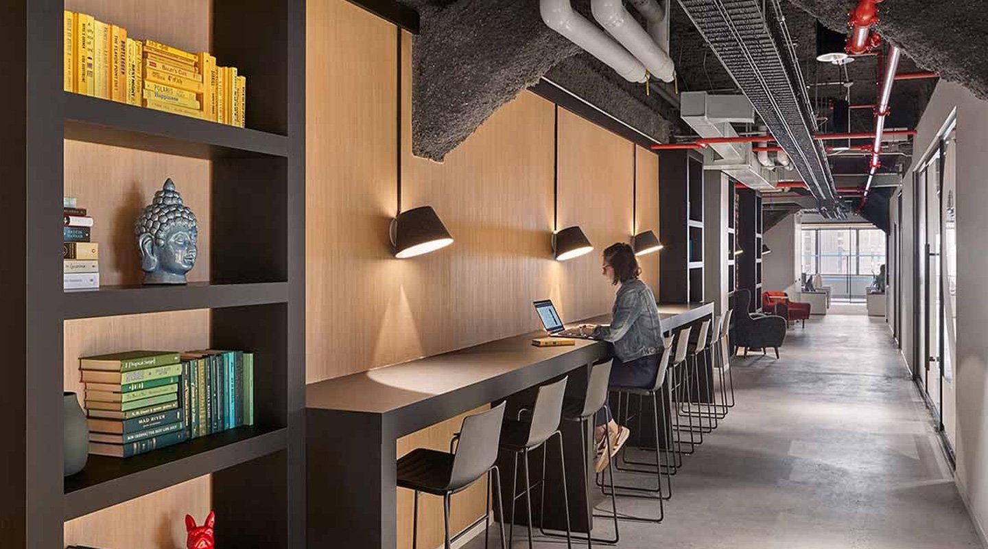 a-wall-of-flexible-working-areas-throughout-a-hallway